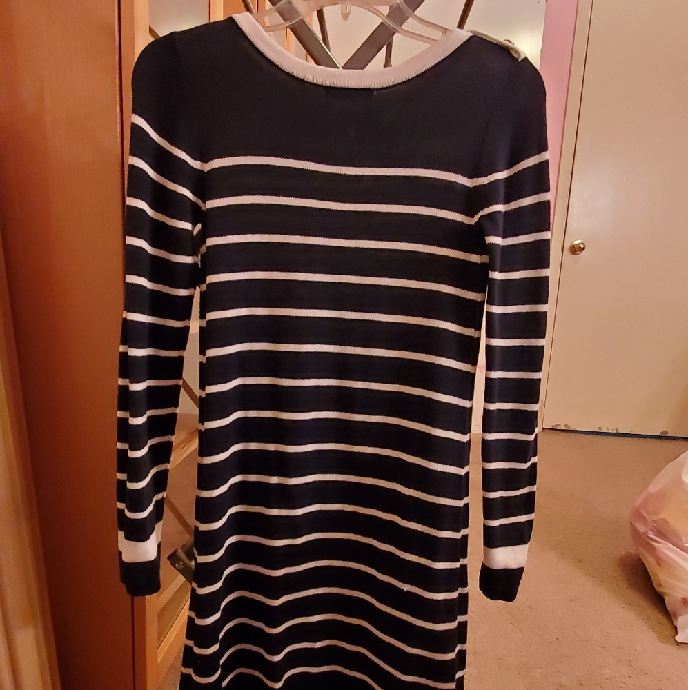 Girls clothes dresses, sweaters and jackets.